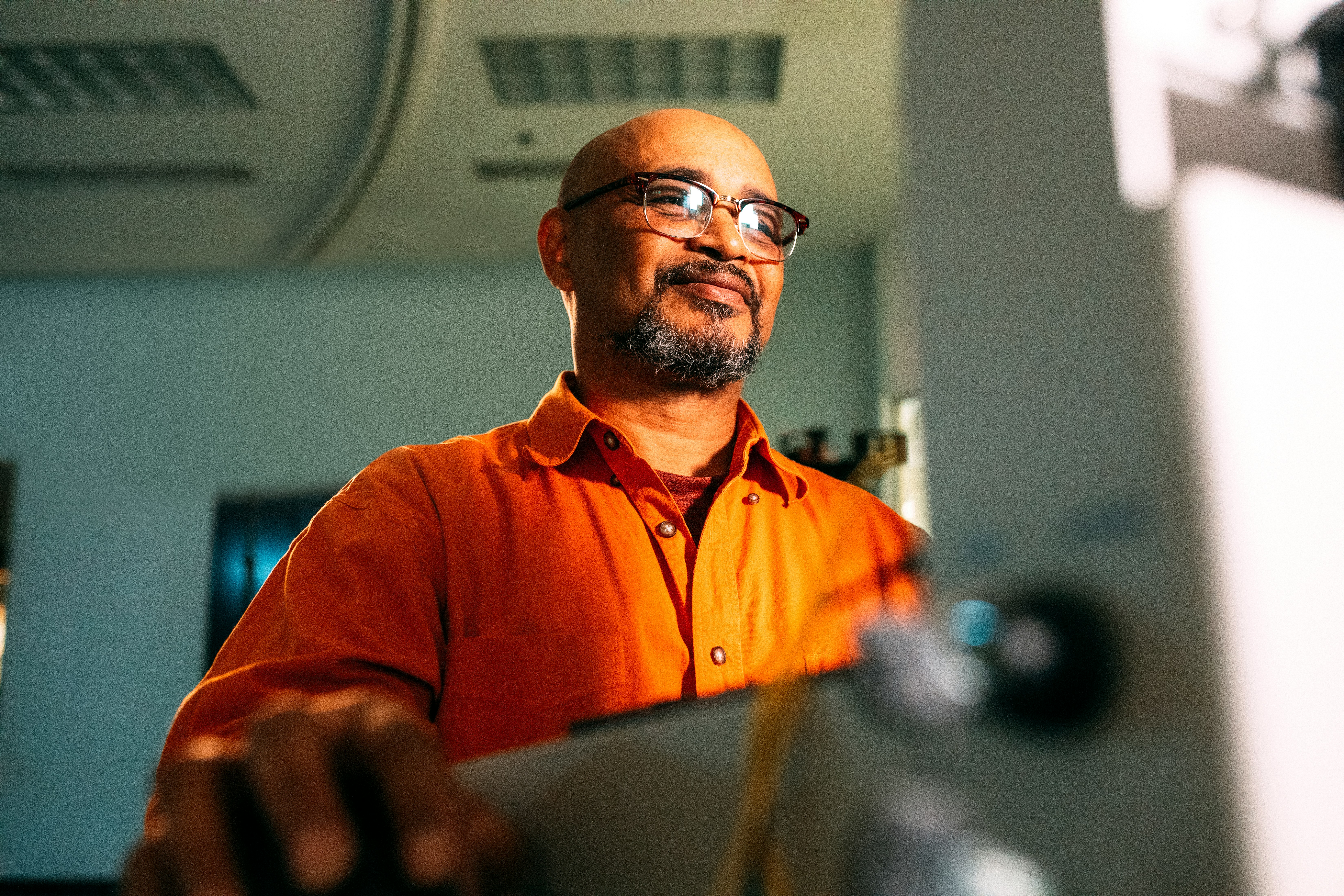 A happy man working at a computer